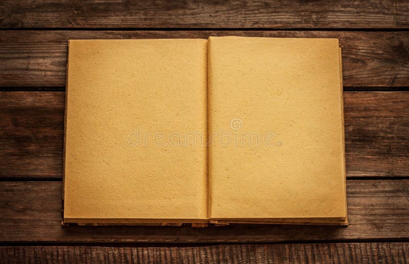Old blank open book on vintage planked wood table stock photo Old blank open book on vintage planked wood table stock photo
