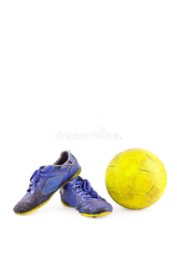 Old blue futsal shoes old yellow futsal ball on white background football object isolated stock photo Old blue futsal shoes old yellow futsal ball on white background football object isolated stock photo
