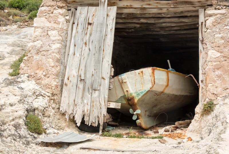 Old boat in a boathouse in Greece