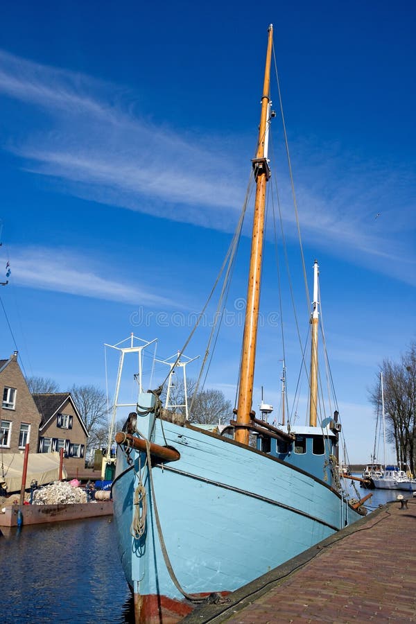 Old boat at the harbor in the Netherlands