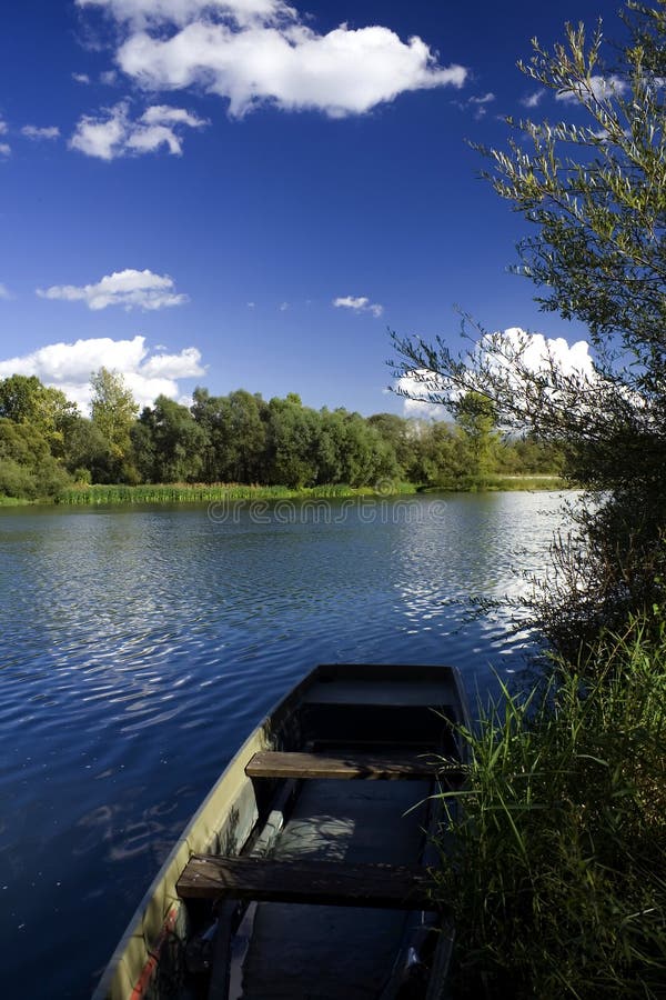 Old boat on river shore