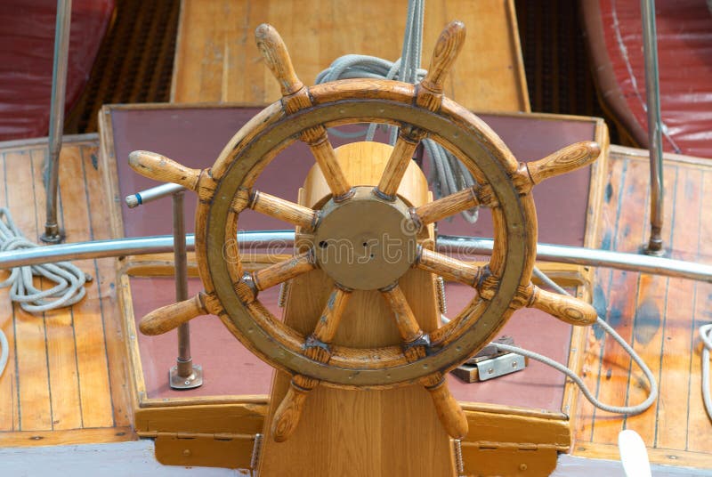 Old boat steering wheel royalty free stock photo