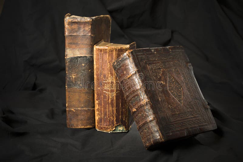 Old book spines on black background. Ancient library. Antique Ho royalty free stock photos