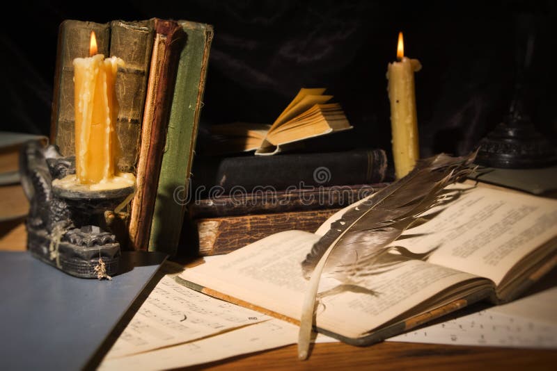 Old books and candles on wooden table stock image Old books and candles on wooden table stock image