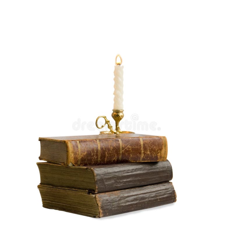 Old books with a candlestick