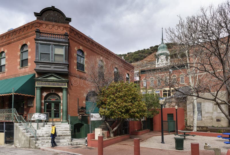 Bisbee, AZ/USA-03-13-2019:  Old Brewery Building is an historical building made of red brick with ornamental detail in the windows with a view of the surrounding buildings in Bisbee, AZ. Bisbee, AZ/USA-03-13-2019:  Old Brewery Building is an historical building made of red brick with ornamental detail in the windows with a view of the surrounding buildings in Bisbee, AZ