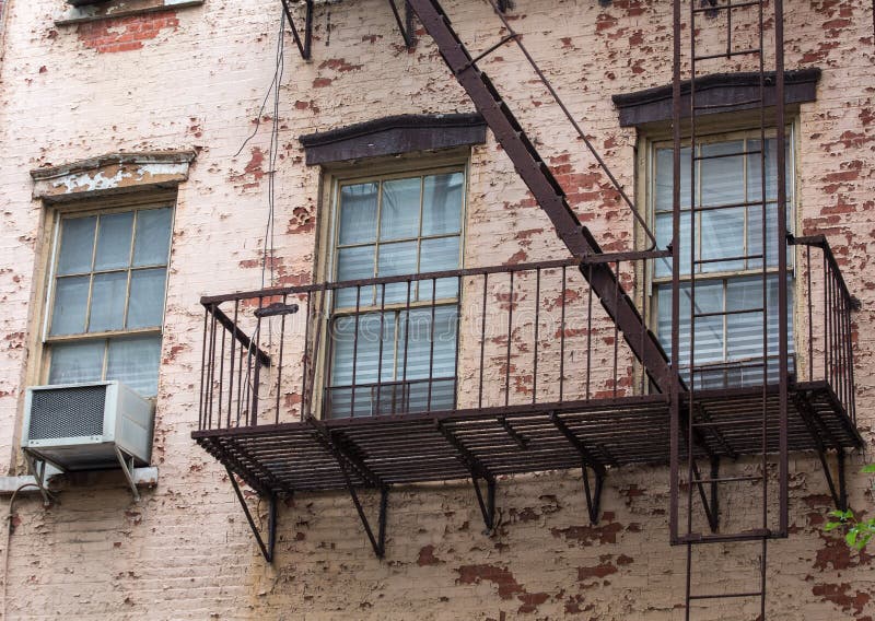 Old brick building with fire escapes in front, Manhattan, New Yo