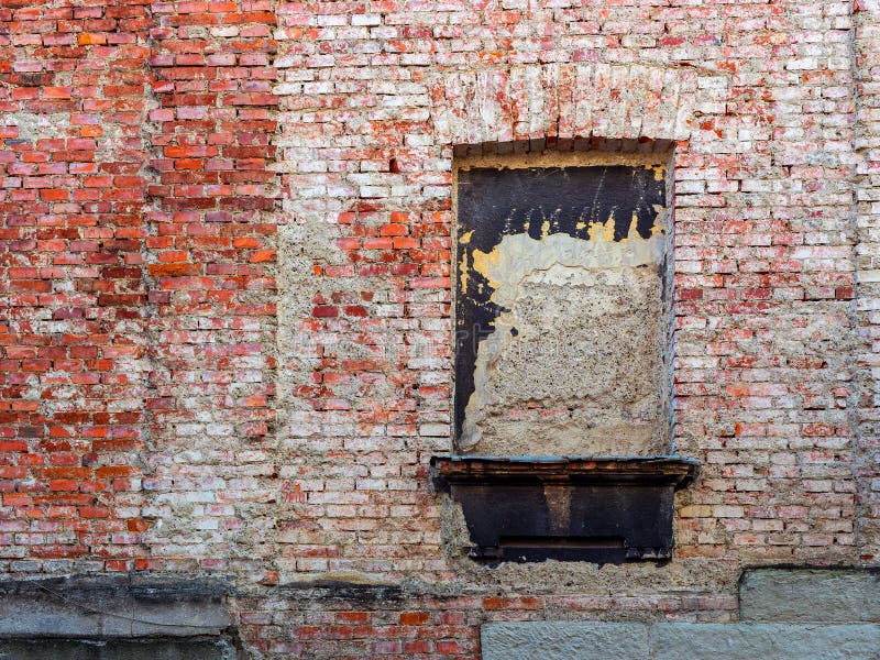 An Old Brick Wall without Plaster, with a Bricked Up Window Stock Image