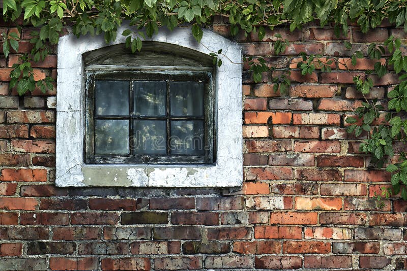 Old brick wall with wooden window