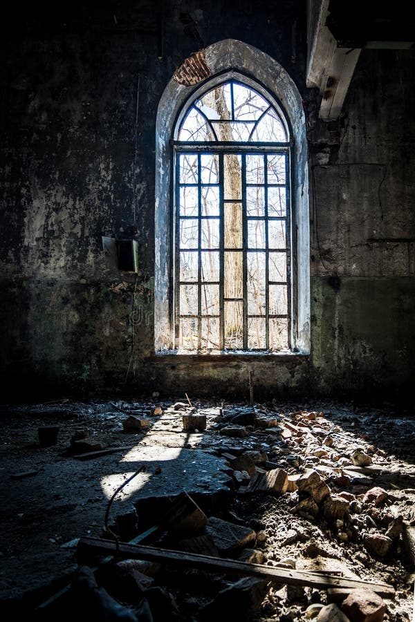 Old broken lancet window inside abandoned building royalty free stock photos