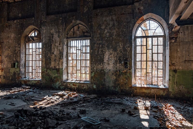 Old broken lancet windows inside abandoned building royalty free stock photography