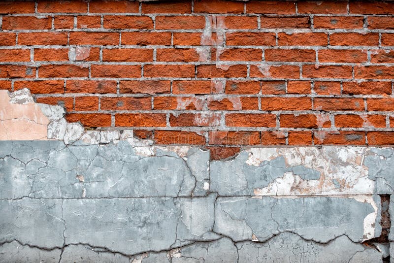 Old broken wall with visible bricks texture