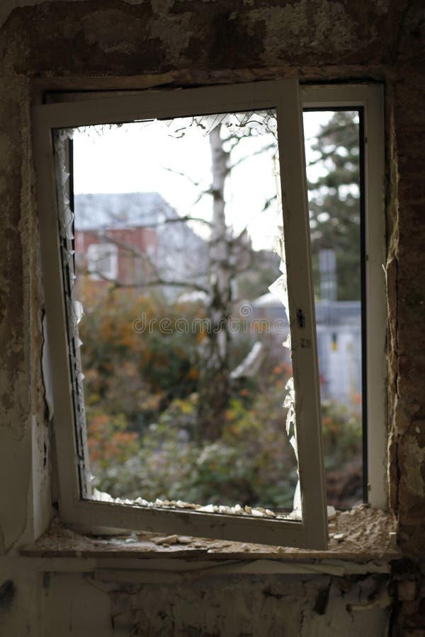 Old broken window with a view to the outside royalty free stock photography Old broken window with a view to the outside royalty free stock photography