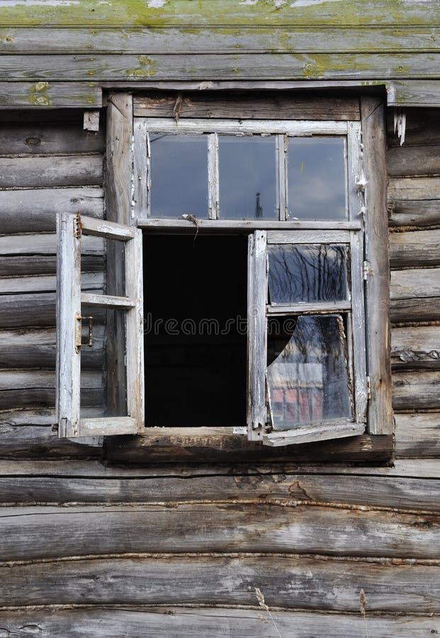 Old broken window of wooden house