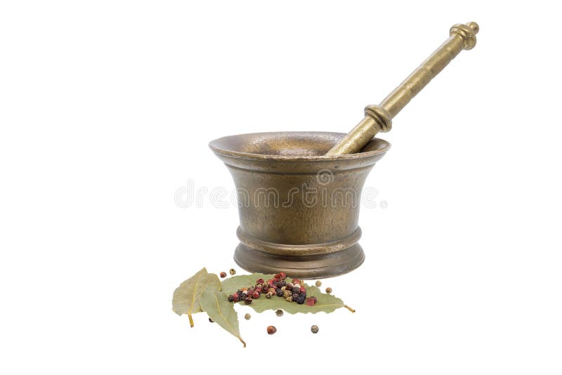 Old bronze mortar and pestle, with mixed of peppers hot, red, black, white and green pepper over bay leaves