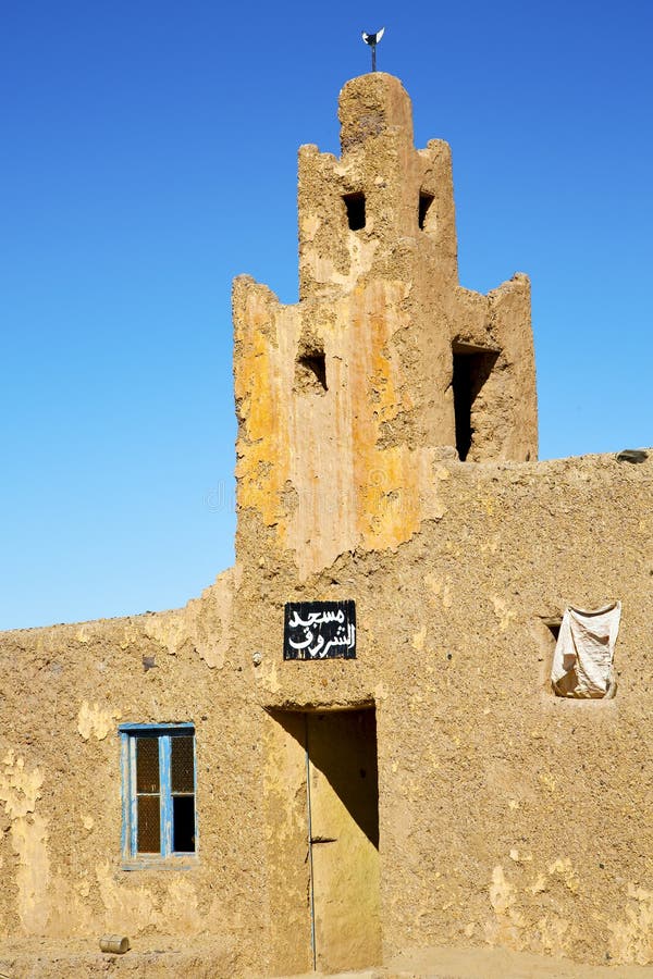 old brown construction in africa sky near the tower