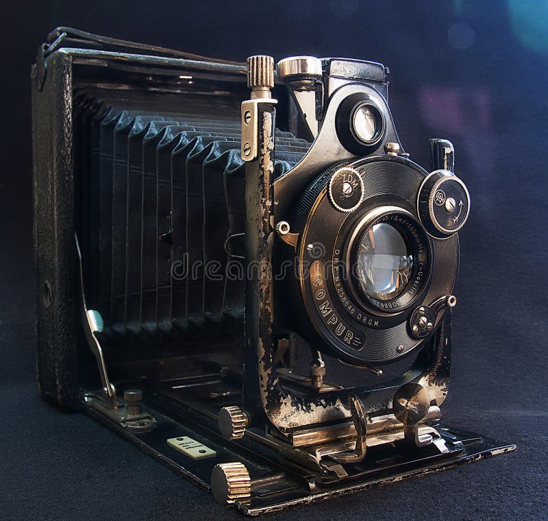 Old camera on black cloth editorial stock image. Image of blue 110431414