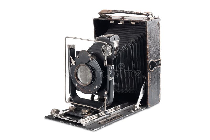 Old camera isolated on white background. Vintage photo camera in an open state