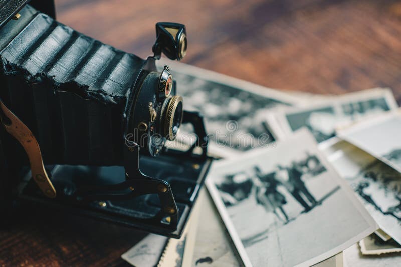 Old camera and photographs closeup royalty free stock images Old camera and photographs closeup royalty free stock images