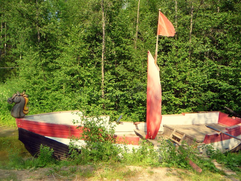 Old canoe by the river stock image Old canoe by the river stock image