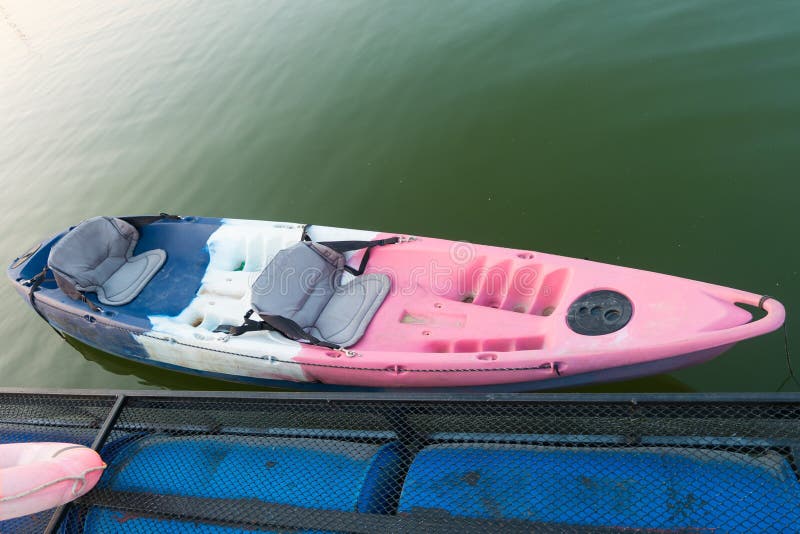 Old Canoes Float on Lake,Thailand. Stock Photo Image of blue, pond