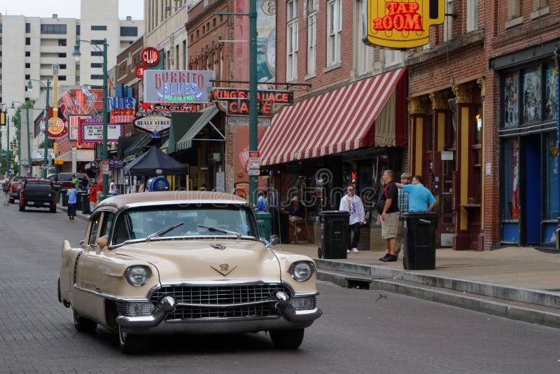 Old car on Beale street. MEMPHIS, TENNESSEE, May 11, 2015 : City neon lights on Beale Street. Blues clubs and restaurants that line Beale Street are major stock photo Old car on Beale street. MEMPHIS, TENNESSEE, May 11, 2015 : City neon lights on Beale Street. Blues clubs and restaurants that line Beale Street are major stock photo