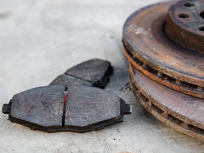 Old Car Brake Pads with Brake Discs at Shallow Depth of Field Stock
