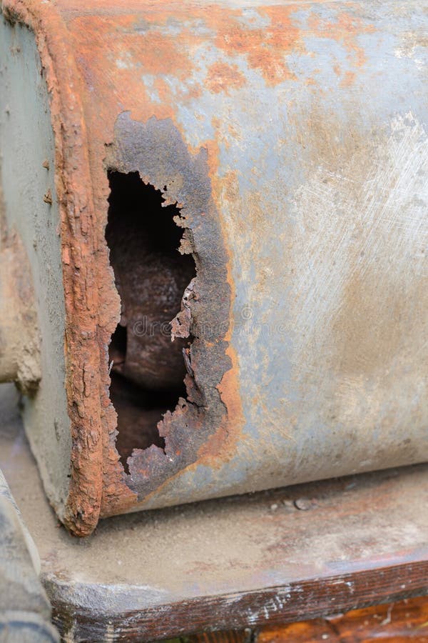 Old Car Muffler. Front and Corrosion Damage. Stock Photo Image of