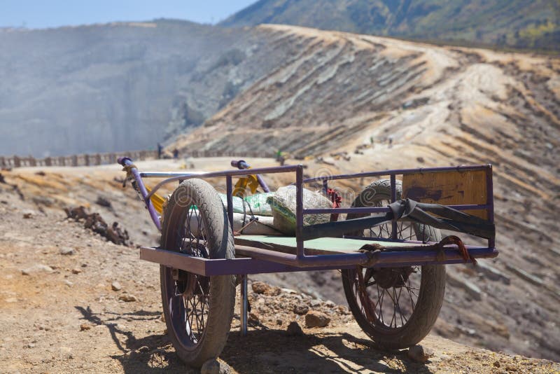 Old cart on a mountain waiting for carrying sulfur down from a mountain. Ijen volcano on Java island