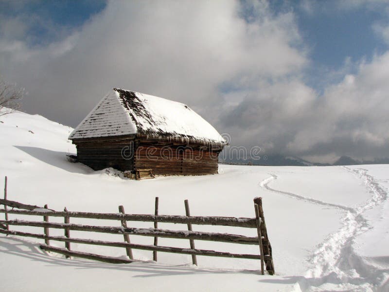 Old chalet in winter