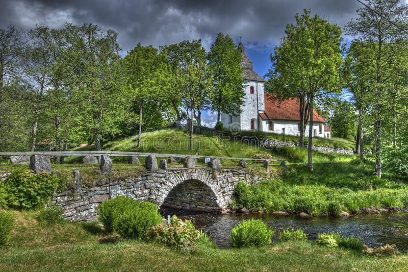 Old church and stone bridge in Sweden