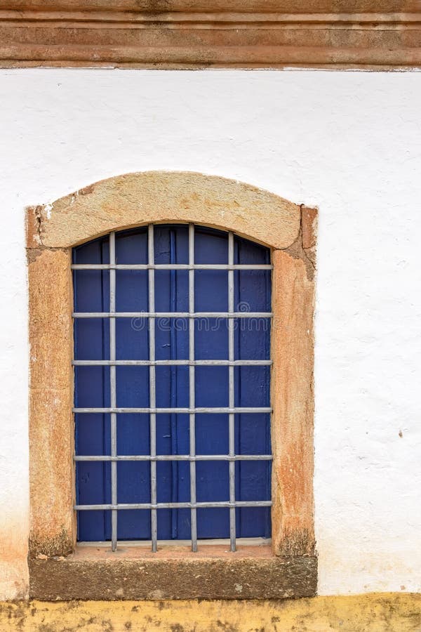 Old church window made of wood in colonial style with frame in stone in Sabara city stock photo Old church window made of wood in colonial style with frame in stone in Sabara city stock photo