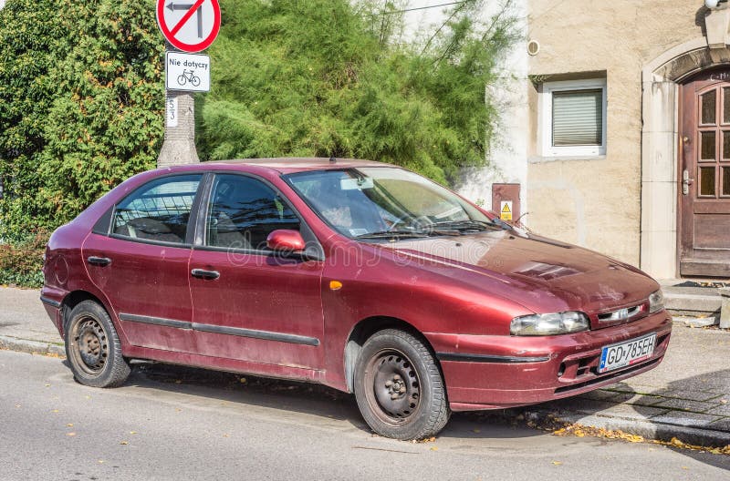 Old Red Fiat Punto Fourdoors Parked Editorial Stock Image - Image