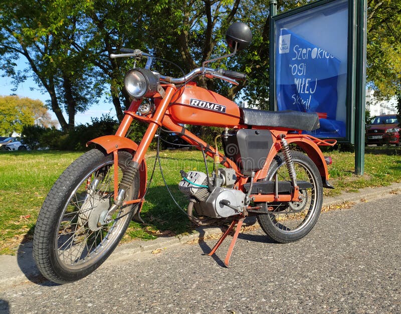 Old classic orange Polish Romet moped parked