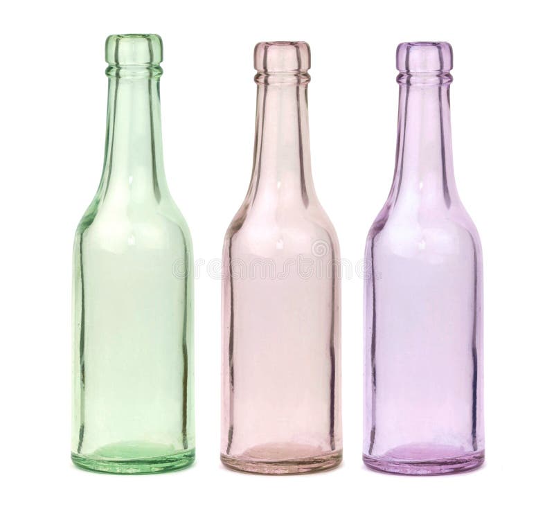 Old colorful glass bottles isolated on white background
