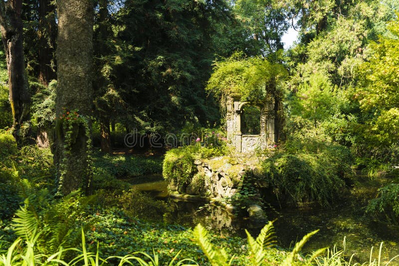 Old concrete tea house in a beautiful garden