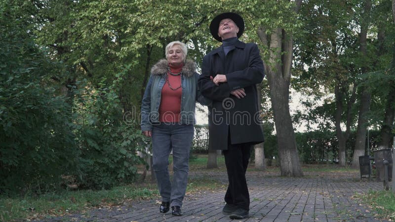 Old couple admire nature in the park