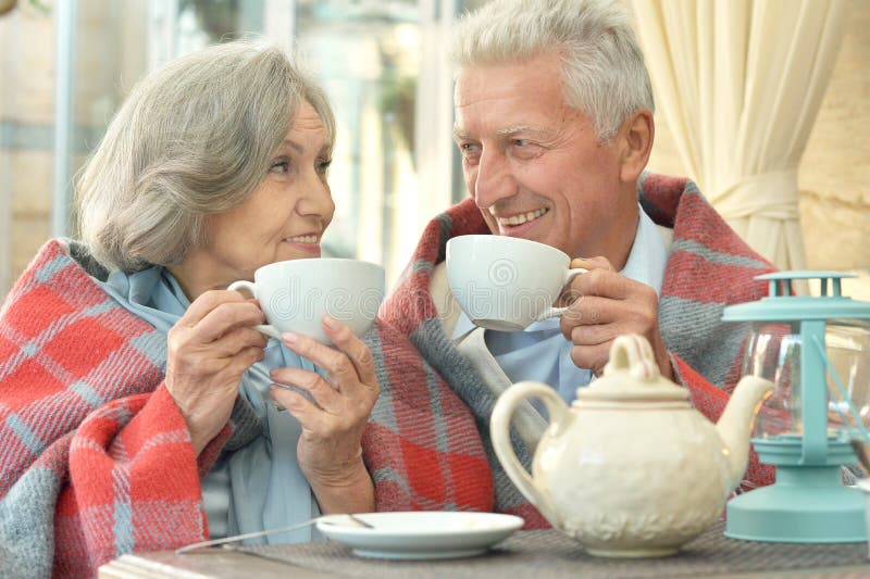 Old couple drinking tea stock image. Image of background 42233383