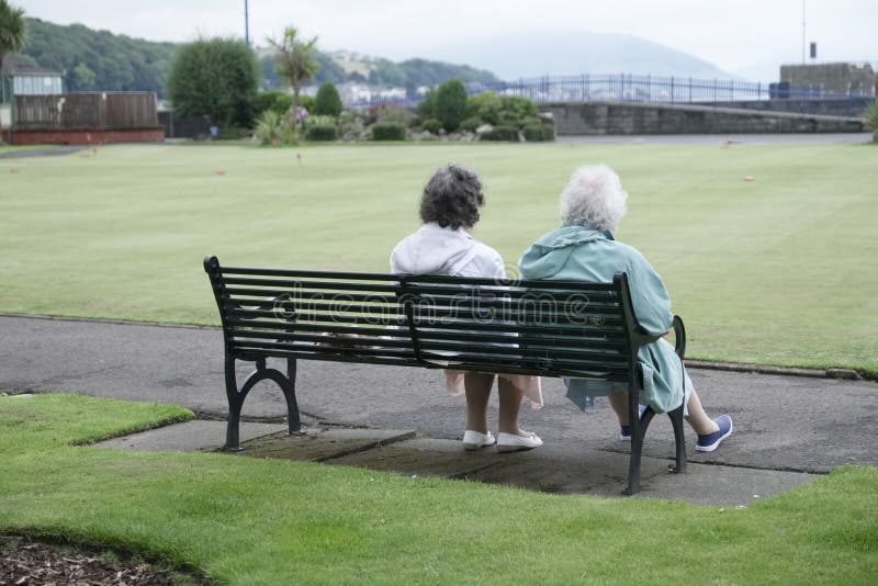 Old couple senior woman park bench summer love relaxing outdoors Rothesay royalty free stock image Old couple senior woman park bench summer love relaxing outdoors Rothesay royalty free stock image