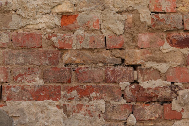 Old cracked brown brick wall textured background royalty free stock image