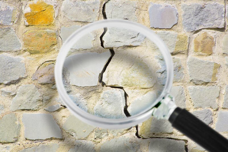 Old Cracked and Damaged Stone Wall Cause Due To Subsidence of