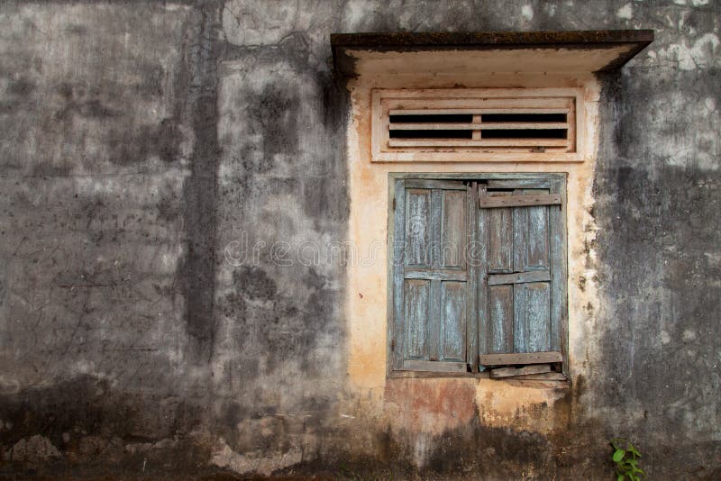Old cracked wall with a window stock photography