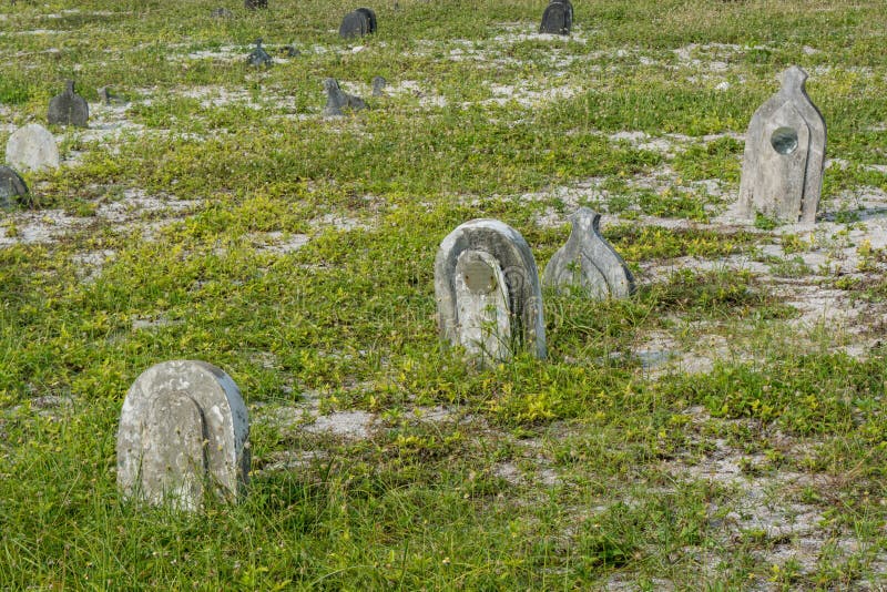 Old creepy burial ground with graves at the tropical local island Maamigili