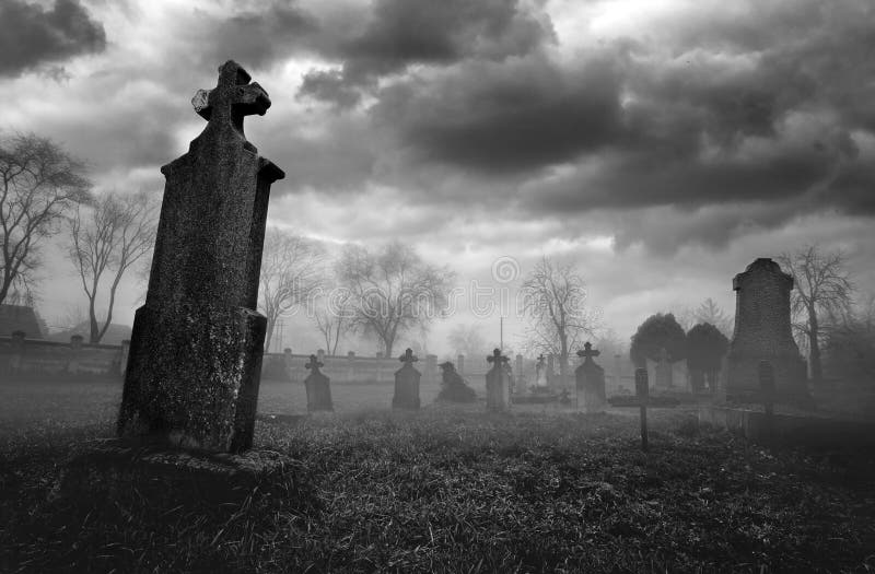 Old creepy graveyard on stormy winter day in black and white royalty free stock photo Old creepy graveyard on stormy winter day in black and white royalty free stock photo