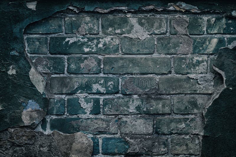 Old dark ramshackle brick wall - grunge background