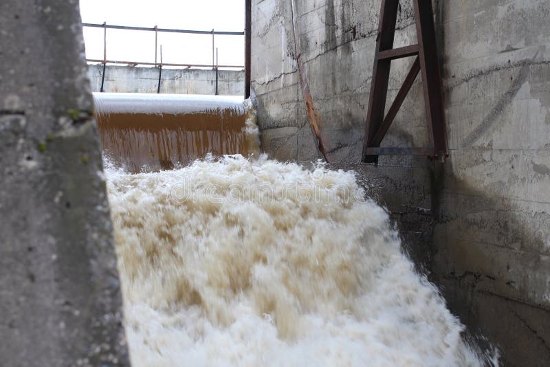 The old dam a powerful stream of water boils of the Siberian village of Verkh-Tula passes the water drains the spring flood stock photos The old dam a powerful stream of water boils of the Siberian village of Verkh-Tula passes the water drains the spring flood stock photos