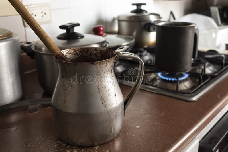 Aluminum Steamer Pot With Big Black Pan On Firewood Burning Stove