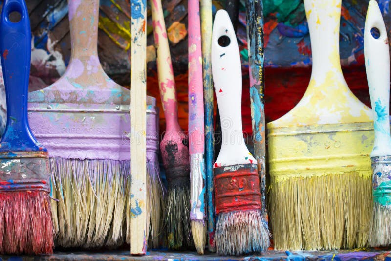 Used Paint Brushes On A Colorful Painter Palette Stock Photo