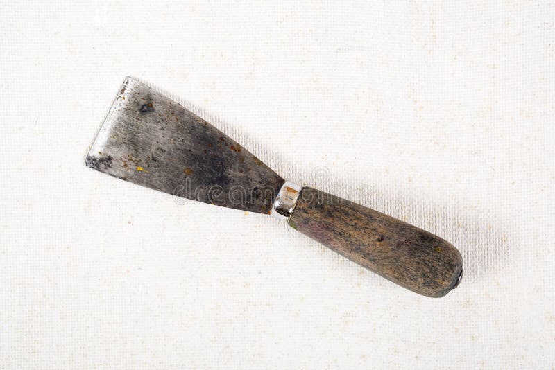 Old dirty and rusty putty kniffe royalty free stock image