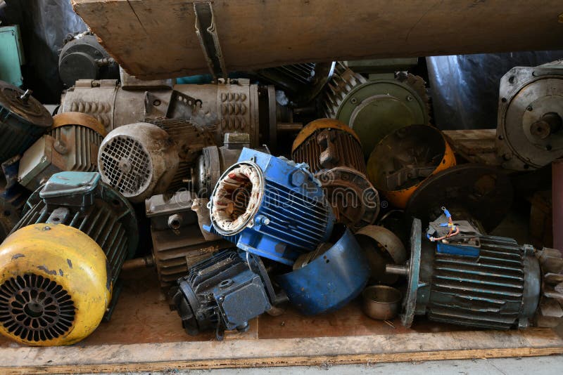 Old Disassembled Electric Motor in a Warehouse for Repair Stock Photo